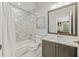Elegant bathroom showcasing marble tile in shower, vanity, and floors at 9712 Tree Tops Lake Rd, Tampa, FL 33626