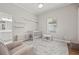 Serene Bedroom with a crib, soft carpet, and lots of light at 9712 Tree Tops Lake Rd, Tampa, FL 33626