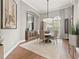 Elegant dining room featuring a round table, chandelier, and stylish decor at 9712 Tree Tops Lake Rd, Tampa, FL 33626