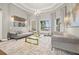 Bright living room showcasing stylish sofas, a glass coffee table, and tasteful decorative accents at 9712 Tree Tops Lake Rd, Tampa, FL 33626