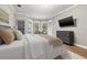 Main bedroom showcases bay windows and soft decor at 9712 Tree Tops Lake Rd, Tampa, FL 33626