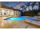 Inviting pool with travertine pavers and lounge area, great for relaxation and entertainment at 9712 Tree Tops Lake Rd, Tampa, FL 33626