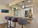 Charming breakfast bar with pendant lighting and seating, offering a cozy spot for casual dining at 100 Bluff View Dr # 115C, Belleair Bluffs, FL 33770