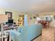Inviting living room with hardwood floors, comfortable seating, and an open concept layout at 100 Bluff View Dr # 115C, Belleair Bluffs, FL 33770