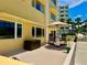 Relaxing patio with comfortable seating, an umbrella, and additional storage make outdoor living easy at 100 Bluff View Dr # 115C, Belleair Bluffs, FL 33770