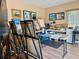 Bright studio space features many painting easels, paint, art supplies, and excellent natural light at 100 Bluff View Dr # 115C, Belleair Bluffs, FL 33770