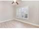 Bedroom with wood floors and shuttered windows for natural light at 10966 Winter Crest Dr, Riverview, FL 33569