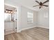 Bedroom boasts an ensuite bathroom, wood floors, and natural light at 10966 Winter Crest Dr, Riverview, FL 33569