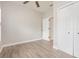 Bedroom features wood floors, a ceiling fan, and closet storage at 10966 Winter Crest Dr, Riverview, FL 33569