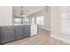 Kitchen island features gray cabinets and a marble countertop with stainless steel appliances at 10966 Winter Crest Dr, Riverview, FL 33569