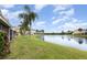Back view of the townhouse community on a pond with lush green space at 10966 Winter Crest Dr, Riverview, FL 33569