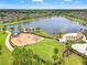 Aerial view of the lake and playground in this Gathering-friendly community at 11434 Leland Groves Dr, Riverview, FL 33579