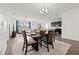 Dining room that flows into a combined living area and a modern kitchen at 11434 Leland Groves Dr, Riverview, FL 33579