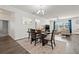 View of a dining room connecting to a cozy living area with great natural lighting at 11434 Leland Groves Dr, Riverview, FL 33579