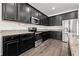 Well-equipped kitchen with dark wood cabinets, stainless steel appliances, and granite countertops at 11434 Leland Groves Dr, Riverview, FL 33579