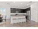 Contemporary kitchen with dark cabinets, granite counters, stainless steel appliances, and a breakfast nook at 11434 Leland Groves Dr, Riverview, FL 33579