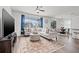 Spacious living area with a large window offering ample natural light, and hardwood floors at 11434 Leland Groves Dr, Riverview, FL 33579