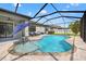 Beautiful screened-in pool with ample seating space perfect for outdoor entertaining at 11434 Leland Groves Dr, Riverview, FL 33579