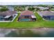 An overhead view of the property highlighting the pool and screened in patio near the water at 11614 Ashton Field Ave, Riverview, FL 33579