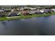 Aerial view of homes with screened lanais overlooking the lake, set in a residential neighborhood at 11614 Ashton Field Ave, Riverview, FL 33579