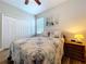 Bright bedroom with a ceiling fan, closet, natural light, and nautical decor at 11614 Ashton Field Ave, Riverview, FL 33579