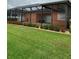 Exterior of a property with a screened-in patio, well maintained lawn and vibrant landscaping at 11614 Ashton Field Ave, Riverview, FL 33579