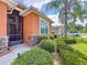 A charming front exterior featuring lush landscaping and a cozy entrance at 11614 Ashton Field Ave, Riverview, FL 33579