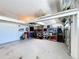 Spacious garage featuring ample storage solutions, including shelving and wall-mounted organizers at 11614 Ashton Field Ave, Riverview, FL 33579