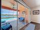 Screened-in patio showcases a beautiful pool and lake view, with comfortable seating and stylish decor at 11614 Ashton Field Ave, Riverview, FL 33579