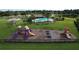 Community playground and pool with lush landscaping and recreational amenities at 11614 Ashton Field Ave, Riverview, FL 33579