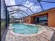Screened-in pool area with brick pavers and a view of the backyard, lawn, and surrounding community at 11614 Ashton Field Ave, Riverview, FL 33579