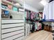 Organized walk-in closet featuring shelving, drawers, clothing racks, and ample storage space for clothes, shoes, and accessories at 11614 Ashton Field Ave, Riverview, FL 33579