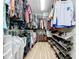 Spacious walk-in closet with organized clothing racks, shoe racks, shelving, and storage for clothes and accessories at 11614 Ashton Field Ave, Riverview, FL 33579