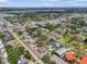 Aerial view of a residential area with tree-lined streets and scattered neighborhood pools at 12546 108Th St, Largo, FL 33778