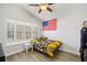 Comfortable bedroom with large bay window, vaulted ceiling, and ceiling fan at 12546 108Th St, Largo, FL 33778
