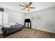 Comfortable bedroom with ceiling fan, modern window, and laminate flooring at 12546 108Th St, Largo, FL 33778