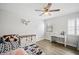 Cozy bedroom with fan, plantation shutters, and stylish decor at 12546 108Th St, Largo, FL 33778