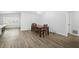 Open dining room with hardwood floors, chandelier, and bright natural light at 12546 108Th St, Largo, FL 33778