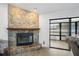 Stone fireplace and sliding glass doors open up to the pool area at 12546 108Th St, Largo, FL 33778