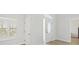 Bright and inviting foyer features a front door with sidelights and a view into other rooms at 12546 108Th St, Largo, FL 33778