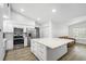 Bright kitchen featuring a large island, stainless steel appliances and plenty of storage at 12546 108Th St, Largo, FL 33778