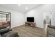 Spacious living room with access to the pool, TV, and comfortable seating at 12546 108Th St, Largo, FL 33778