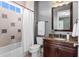 Full bathroom showcases decorative wall tile, vanity with granite countertop and a shower and tub combo at 131 Miramar Ne Blvd, St Petersburg, FL 33704