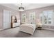 Serene bedroom with white furniture, plantation shutters, and soothing lilac-colored walls at 131 Miramar Ne Blvd, St Petersburg, FL 33704