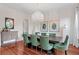 Chic dining room with hardwood floors, stylish chandelier, and seating for six at 131 Miramar Ne Blvd, St Petersburg, FL 33704