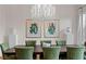 Inviting dining room with hardwood floors, a unique chandelier, and seating for six at 131 Miramar Ne Blvd, St Petersburg, FL 33704