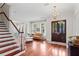 Grand foyer featuring gleaming hardwood floors, high ceilings, and a staircase at 131 Miramar Ne Blvd, St Petersburg, FL 33704