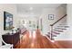 Bright foyer with hardwood floors, stairs, and views to the living room and the backyard at 131 Miramar Ne Blvd, St Petersburg, FL 33704
