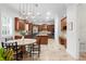 Gourmet kitchen with wooden cabinets, stainless steel appliances, and an island at 131 Miramar Ne Blvd, St Petersburg, FL 33704