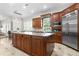 This gourmet kitchen features a granite island, stainless refrigerator and lots of cabinet space at 131 Miramar Ne Blvd, St Petersburg, FL 33704